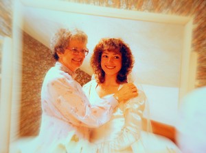 Mom helping me dress wedding day 1982